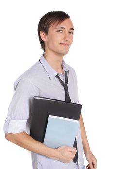 A handsome student holding his documents while standing in front of a white background.