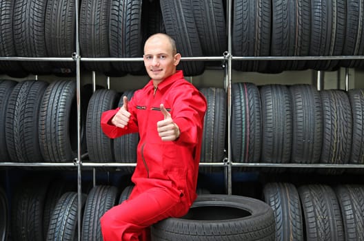 A positive worker in a workshop making a positive gesture.