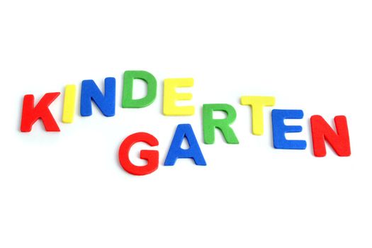 Varicolored letters building the word Kindergarten. All isolated on white background.