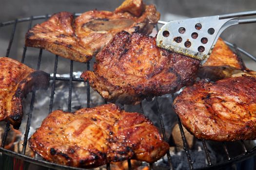 A nice grill barbecue with delicious marinaded steaks.