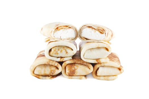 rolled pancakes with cottage cheese on a light background