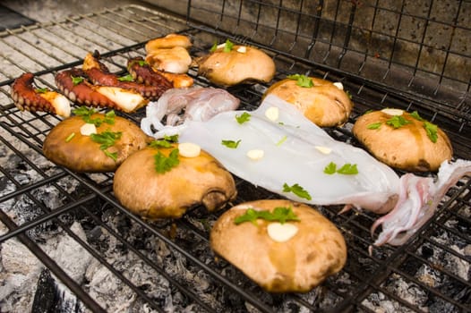 Porto bello mushrooms and sea food on barbecue, Greek cuisine