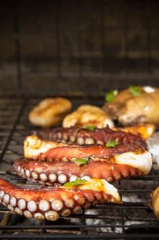 Octopus, Porto Bello mushrooms and other sea food on barbecue, Greek cuisine