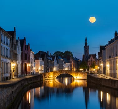 European medieval night city view background - Bruges (Brugge) canal in the evening, Belgium