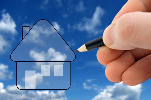 A person sketching his dream house in front of bright blue sky.