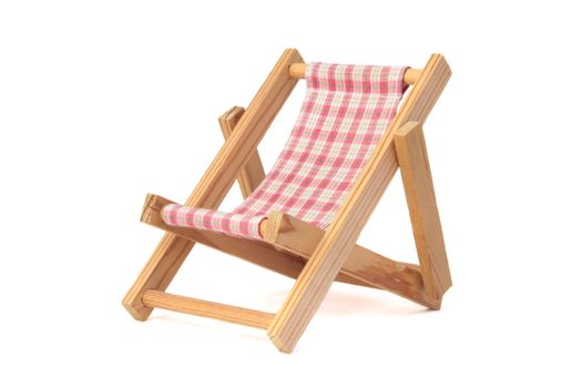 A standard deck chair on a green meadow. All isolated on white background.