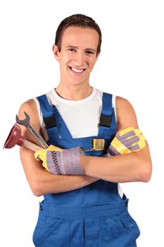 A young plumber trainee. All isolated on white background.