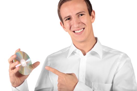 A young attractive man holding a cd or dvd. All isolated on white background.