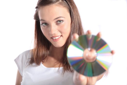 An attractive young woman holding a CD-Rom or DVD.  All isolated on white background.
