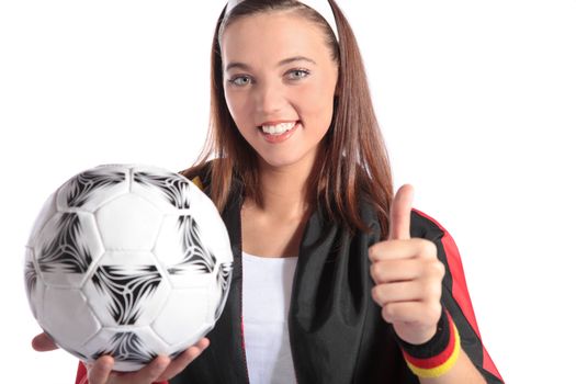 An attractive german soccer fan wearing several fan utensils and holding a soccer ball. All isolated on white background.