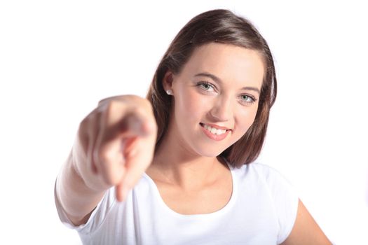 An attractive young woman pointing at someone. All isolated on white background.