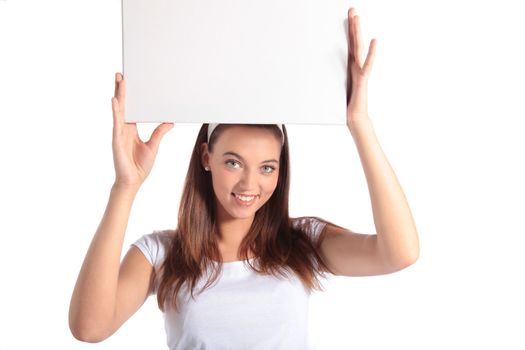 An attractive young woman holding a white board. All isolated on white background.