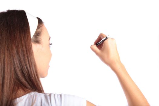 An attractive young woman sketching. All isolated on white background.