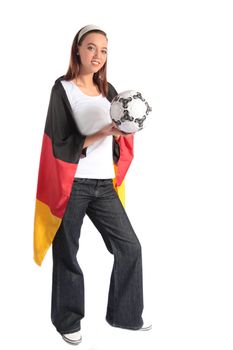 Full length shot of an attractive German soccer fan wearing several fan utensils and holding a soccer ball. All isolated on white background.