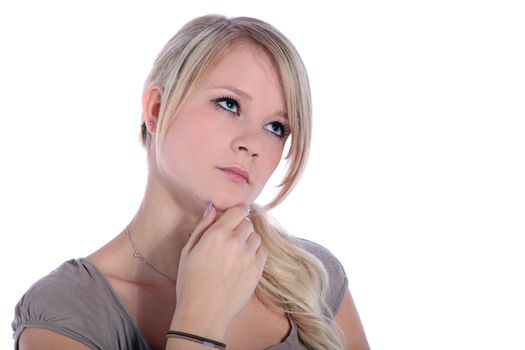 An attractive young woman deliberates a decision. All on white background.