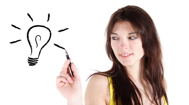 An attractive young woman sketching a stylized light bulb. All isolated on white background.