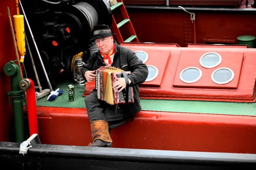 Finnish Steamship captain, plays the accordion