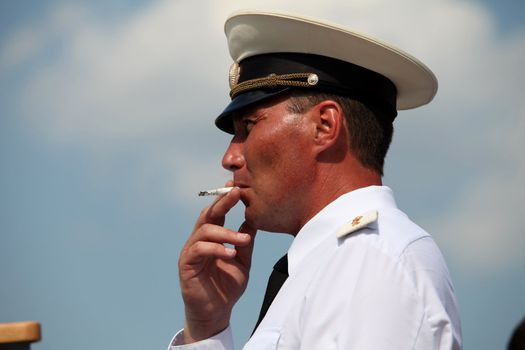Russian Navy Warrant Officer smoking, portrait, side view