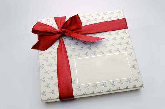 Printed over a red ribbon gift box
