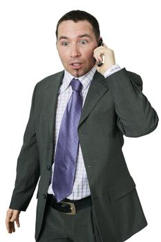 A handsome businessman getting bad news on his cellphone.
