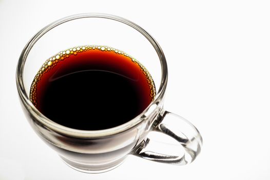 Coffee in glass  cup on white background (seen from above) horizontal