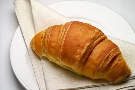Croissant and linen napkin
