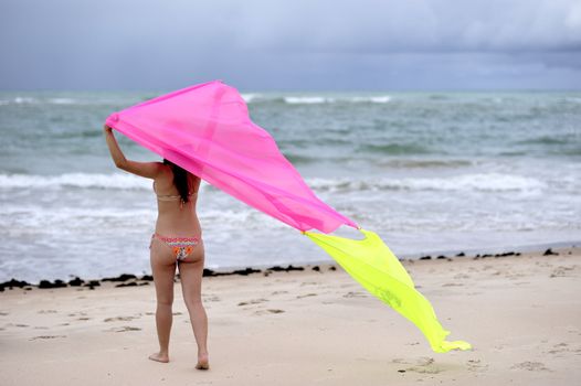 Woman enjoying the beach in Brazil, Salvador de Bahia.