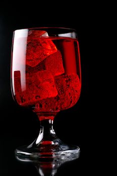 Glass of red drink with ice closeup (C2)