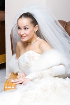 happy bride in the chair