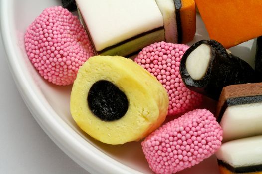 Licorice candies in bowl closeup