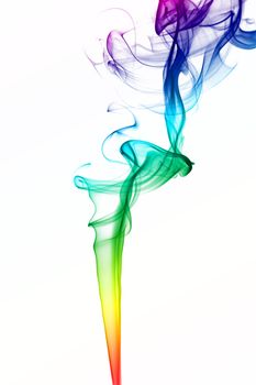 Smoke from incense stick - rainbow colors on white.