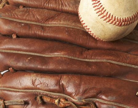 a macro of a baseball in glove