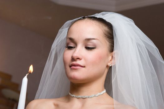 bride with a birning candle