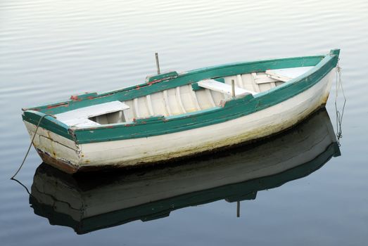 Small fishing boat floating on the water