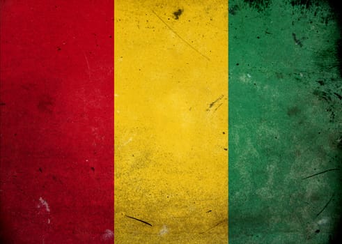 The flag of Guinea on old and vintage grunge texture