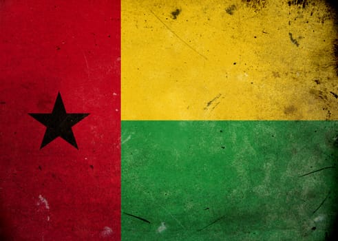 The flag of Guinea Bissau on old and vintage grunge texture
