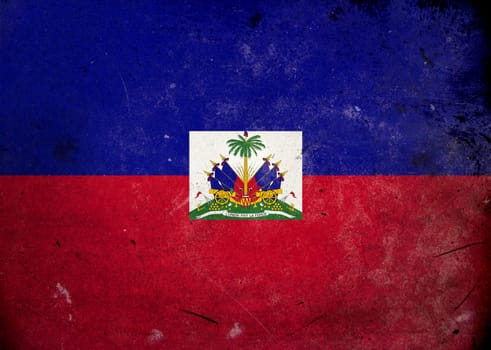 The flag of Haiti on old and vintage grunge texture