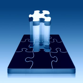A metallic Blue Puzzle with the final piece being placed into it.