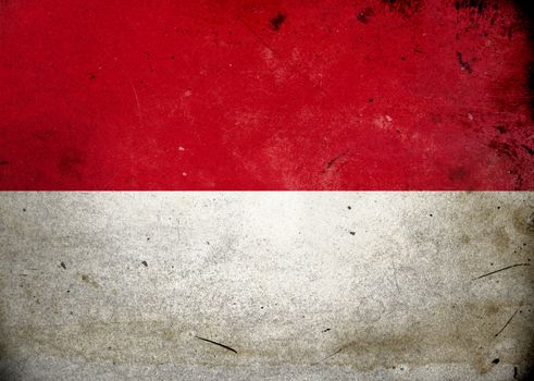 The flag of Indonesia on old and vintage grunge texture