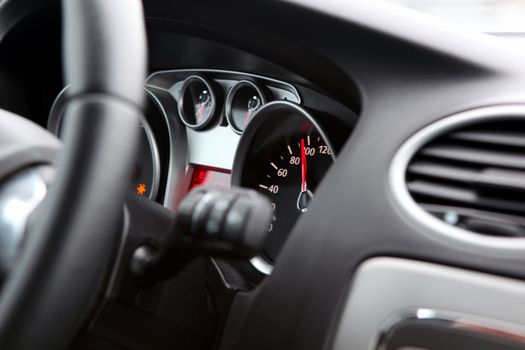 Illuminated car dashboard in red and black