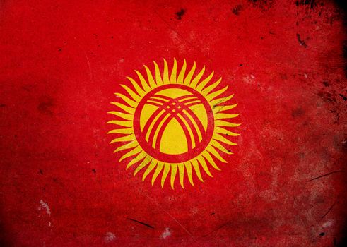 The flag of Kyrgyzstan on old and vintage grunge texture