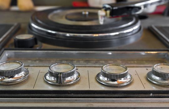 Old record-player with a scratched gramophone record