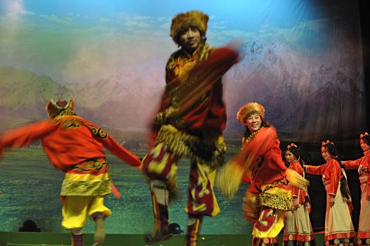 CHENGDU - JAN 20: Tibetan ethnic dancers perform folk dance drama onstage at JinJing theater on Jan 20, 2010 in Chengdu, China.