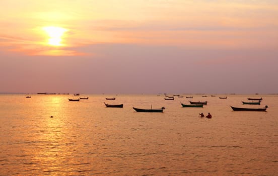 Fishing boats with sunset