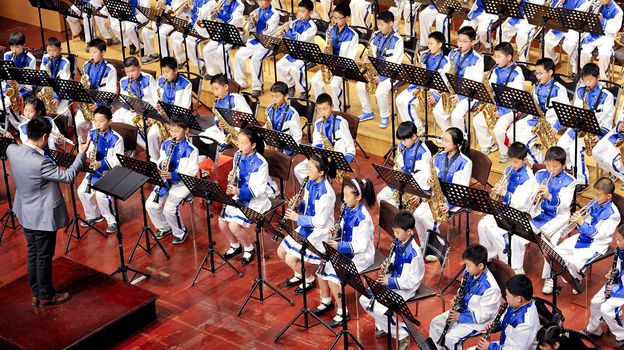 CHENGDU - APR 23: student symphonic band of High School No.7 Chengdu perform on concert on Apr 23,2011 in Chengdu,China.