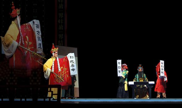 CHENGDU - JUN 6: Mulian Drama of Chinese Qi opera performer make a show on stage to compete for awards in 25th Chinese Drama Plum Blossom Award competition at Experimental theater.Jun 6, 2011 in Chengdu, China.
