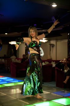 CAIRO - JAN 27: belly dancer performing on a yacht in River Nile.Jan 27,2013 in Cairo,Egypt.