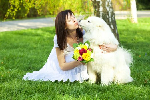 young bride and the dog on the nature