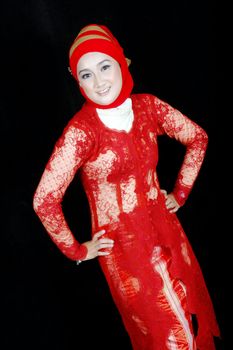 portrait of an asian young girl dressed in kebaya traditional isolated on black background