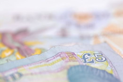 Macro image of English bank notes. Focus on �5 note.